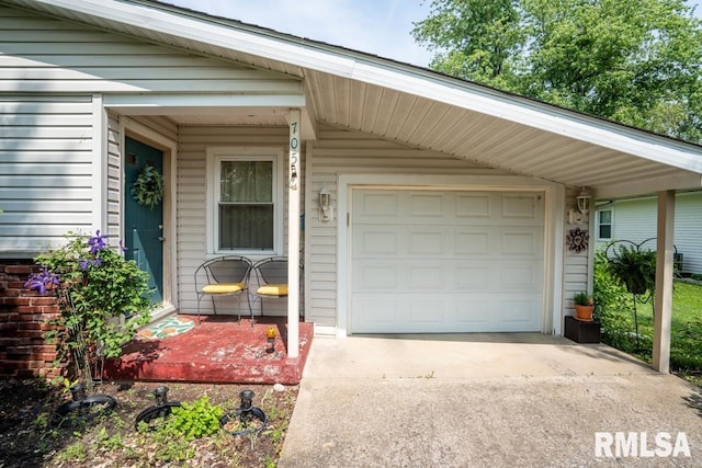 705 S Hadfield St, Marion, IL 62959 - garage with concrete driveway and a carport
