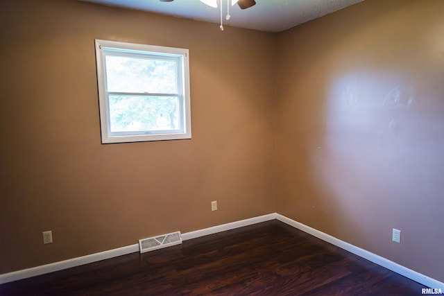 107 N 1st St, West Point, IL 62380 - unfurnished room featuring ceiling fan and dark wood-style floors