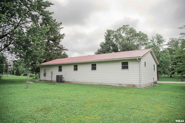 107 N 1st St, West Point, IL 62380 - rear view of house featuring a yard, crawl space, and a metal roof