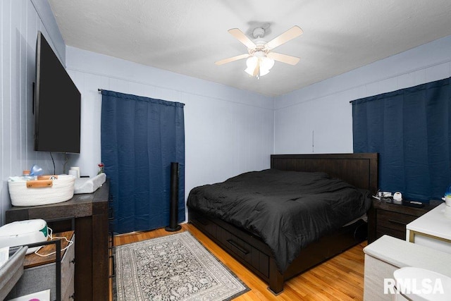 2531 5th St, Moline, IL 61265 - bedroom with light wood-style flooring and a ceiling fan