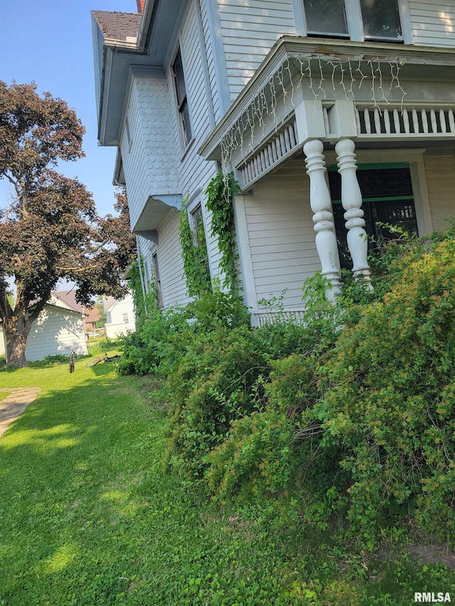 606 Meridian St Unit 1 & 2, Tipton, IA 52772 - view of property exterior with a lawn