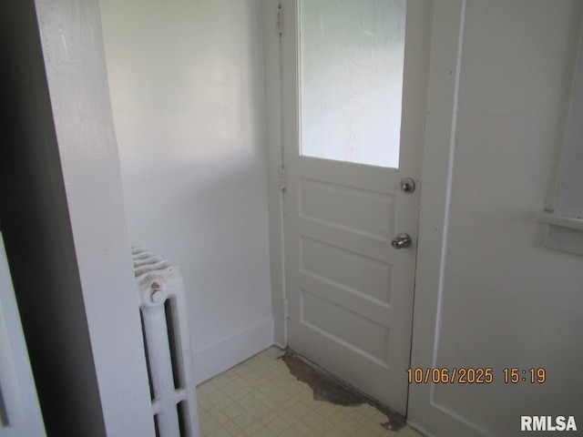 606 Meridian St Unit 1 & 2, Tipton, IA 52772 - entryway with radiator and light flooring