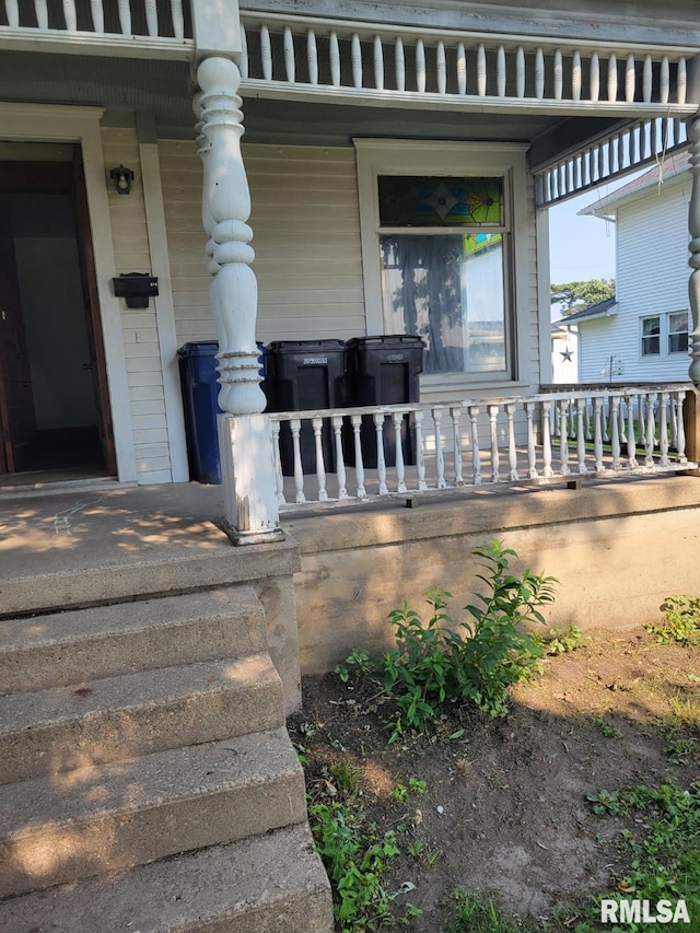 606 Meridian St Unit 1 & 2, Tipton, IA 52772 - property entrance with a porch