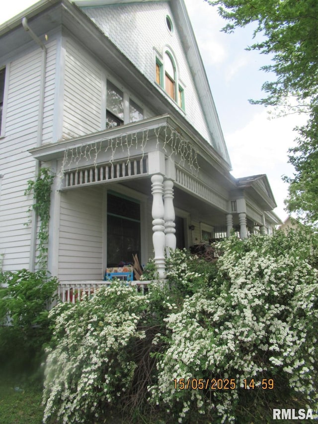 606 Meridian St Unit 1 & 2, Tipton, IA 52772 - view of home's exterior featuring a porch