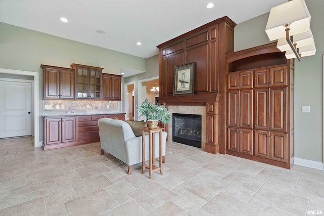 11 Sandstone Ct, Le Claire, IA 52753 - living area featuring recessed lighting, a fireplace, and light stone finish flooring