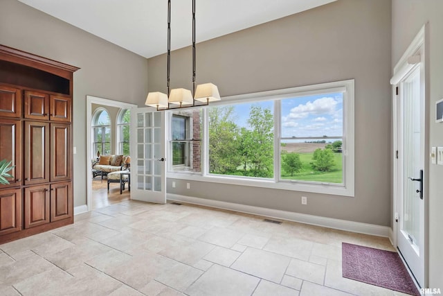 11 Sandstone Ct, Le Claire, IA 52753 - foyer entrance with french doors, plenty of natural light, and a towering ceiling