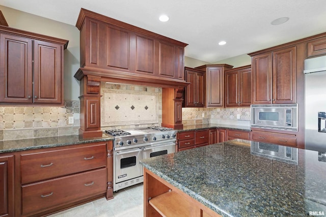 11 Sandstone Ct, Le Claire, IA 52753 - kitchen featuring high end appliances, decorative backsplash, dark stone countertops, open shelves, and recessed lighting