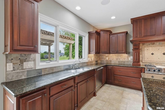 11 Sandstone Ct, Le Claire, IA 52753 - kitchen featuring appliances with stainless steel finishes, tasteful backsplash, dark stone counters, and recessed lighting