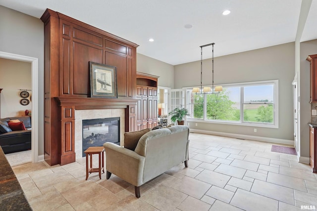11 Sandstone Ct, Le Claire, IA 52753 - living room featuring a tile fireplace and recessed lighting