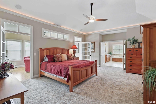11 Sandstone Ct, Le Claire, IA 52753 - bedroom featuring light carpet, multiple windows, french doors, connected bathroom, and ornamental molding