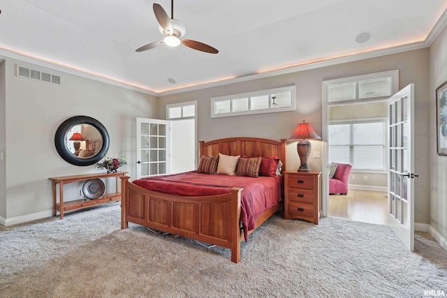 11 Sandstone Ct, Le Claire, IA 52753 - carpeted bedroom featuring french doors, multiple windows, ornamental molding, and ceiling fan