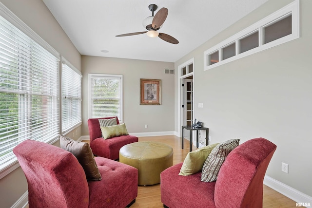 11 Sandstone Ct, Le Claire, IA 52753 - sitting room with a ceiling fan and light wood-type flooring