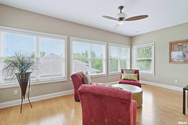 11 Sandstone Ct, Le Claire, IA 52753 - living area featuring ceiling fan and light wood-style flooring
