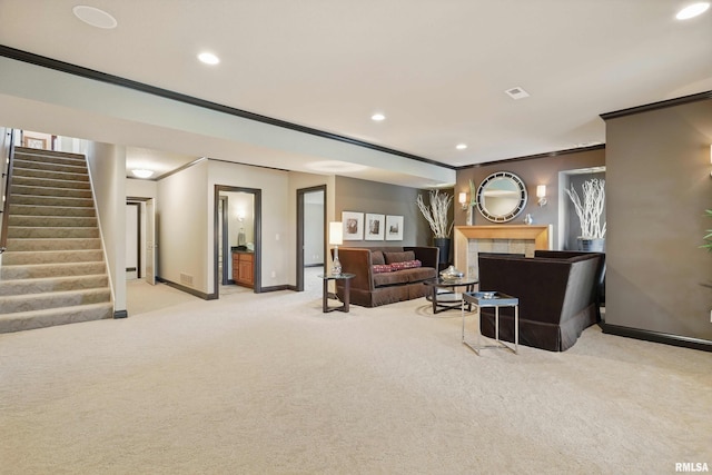 11 Sandstone Ct, Le Claire, IA 52753 - carpeted living area with crown molding, stairway, recessed lighting, and a tiled fireplace