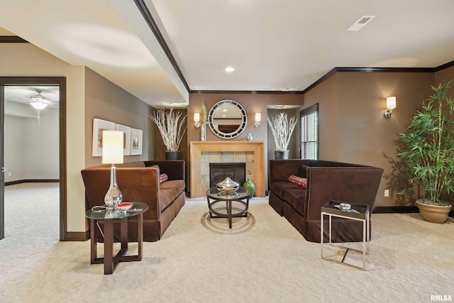 11 Sandstone Ct, Le Claire, IA 52753 - living room with carpet, a ceiling fan, a fireplace, and crown molding