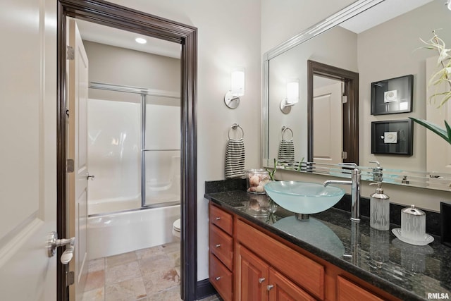 11 Sandstone Ct, Le Claire, IA 52753 - bathroom with vanity, shower / bath combination with glass door, and stone finish flooring