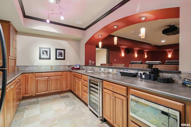 11 Sandstone Ct, Le Claire, IA 52753 - bar featuring wine cooler, a tray ceiling, stainless steel microwave, crown molding, and track lighting