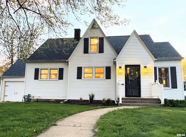 323 N Vail St, Geneseo, IL 61254 - view of front of property with a chimney, a shingled roof, and a front yard