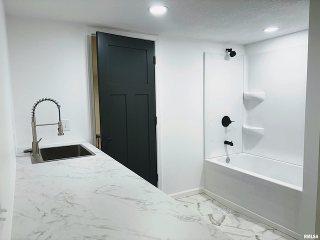 323 N Vail St, Geneseo, IL 61254 - full bath with washtub / shower combination, marble look tiles, and recessed lighting