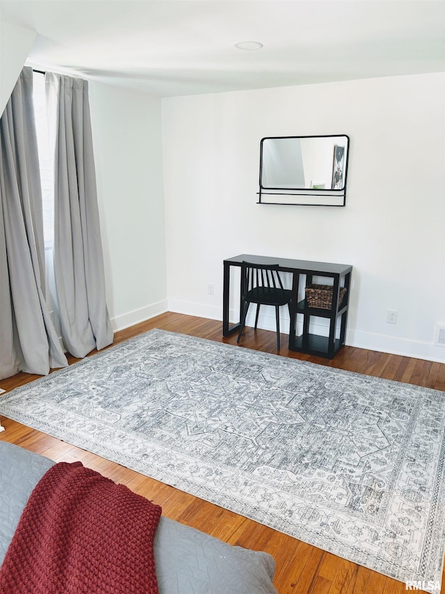 323 N Vail St, Geneseo, IL 61254 - bedroom featuring baseboards and wood finished floors