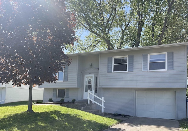 1951 Bristol Dr, Bettendorf, IA 52722 - split foyer home featuring an attached garage, entry steps, a front lawn, and brick siding