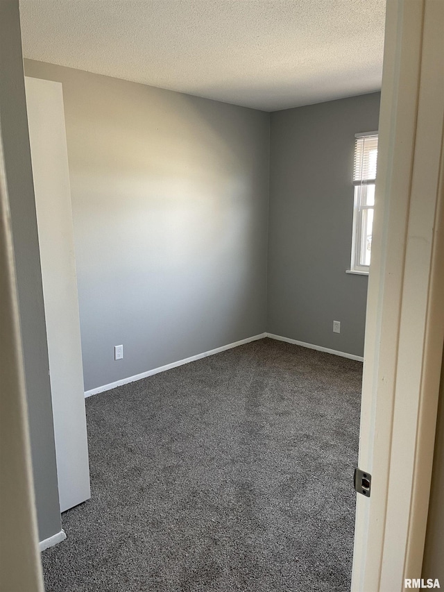 1951 Bristol Dr, Bettendorf, IA 52722 - empty room featuring carpet floors and a textured ceiling