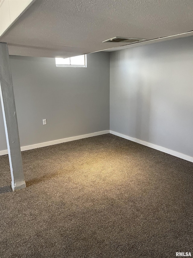 1951 Bristol Dr, Bettendorf, IA 52722 - below grade area with carpet flooring and a textured ceiling