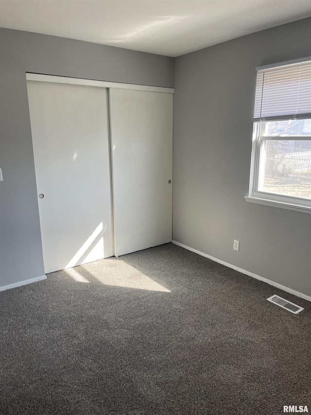 1951 Bristol Dr, Bettendorf, IA 52722 - unfurnished bedroom with carpet flooring and a closet
