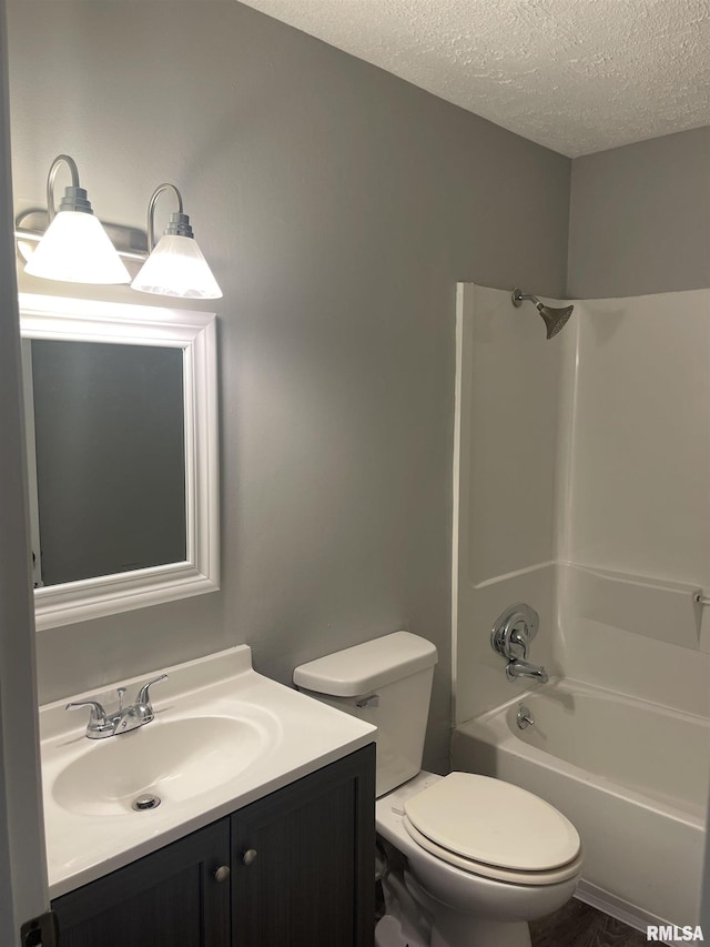 1951 Bristol Dr, Bettendorf, IA 52722 - bathroom featuring a textured ceiling, vanity, and shower / bath combination