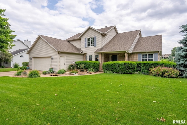 1010 Meadows Cir, Bettendorf, IA 52722 - traditional home with a front yard, roof with shingles, a garage, driveway, and brick siding