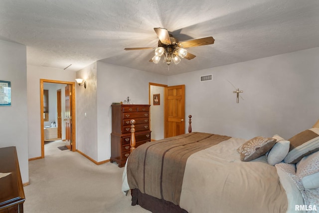 1010 Meadows Cir, Bettendorf, IA 52722 - bedroom featuring light colored carpet, a ceiling fan, a textured ceiling, and ensuite bath