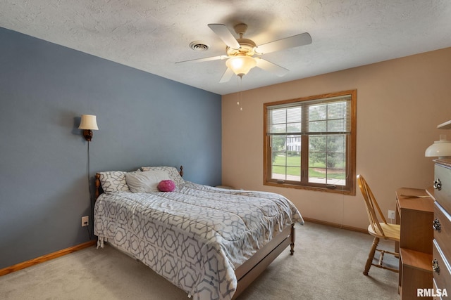 1010 Meadows Cir, Bettendorf, IA 52722 - bedroom featuring light carpet, a textured ceiling, and ceiling fan
