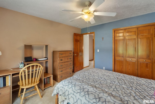 1010 Meadows Cir, Bettendorf, IA 52722 - bedroom with light carpet, a closet, a ceiling fan, and an office area
