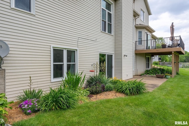 1010 Meadows Cir, Bettendorf, IA 52722 - rear view of house featuring a lawn and a patio