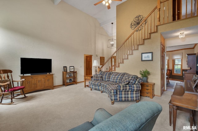 1010 Meadows Cir, Bettendorf, IA 52722 - living area with carpet, stairs, ceiling fan, and high vaulted ceiling