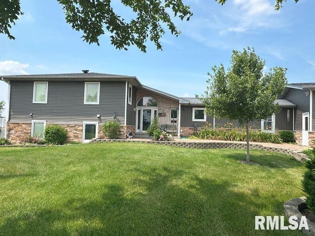 2347 230th Ave, Grand Mound, IA 52751 - rear view of house featuring a yard and stone siding