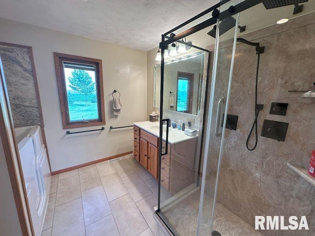 2347 230th Ave, Grand Mound, IA 52751 - bathroom featuring vanity, a shower stall, and tile patterned flooring