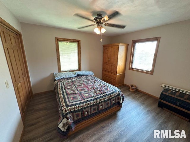 2347 230th Ave, Grand Mound, IA 52751 - bedroom with wood finished floors and a ceiling fan