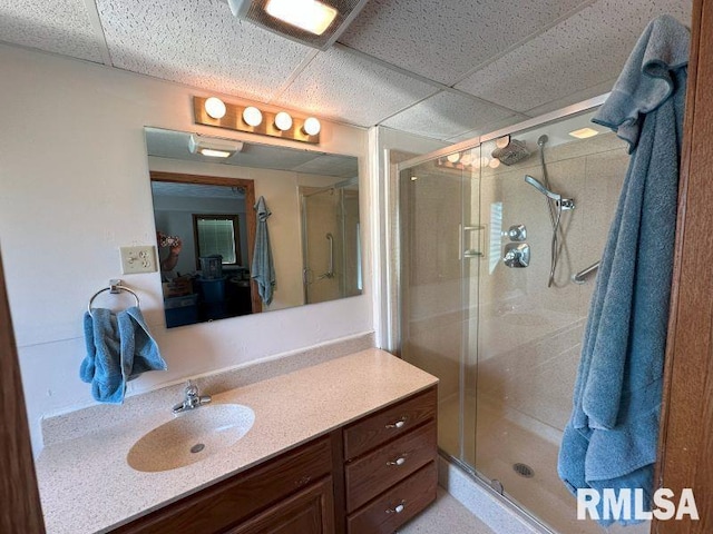 2347 230th Ave, Grand Mound, IA 52751 - bathroom with a paneled ceiling, a shower stall, and vanity