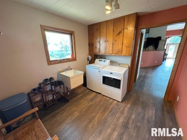 2347 230th Ave, Grand Mound, IA 52751 - washroom with cabinet space, independent washer and dryer, and dark wood-type flooring