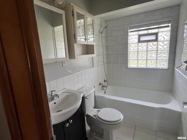 448 E 4th St, Milan, IL 61264 - full bath featuring tile walls, vanity, tile patterned flooring, and shower / bath combination