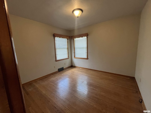 448 E 4th St, Milan, IL 61264 - empty room featuring light wood-style floors and baseboards
