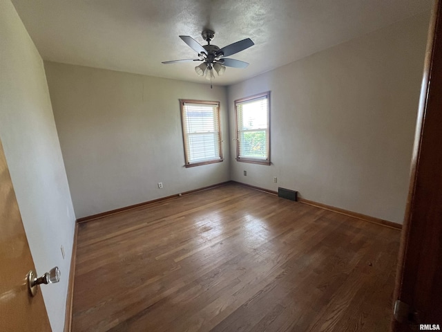 448 E 4th St, Milan, IL 61264 - unfurnished room with a ceiling fan and wood finished floors