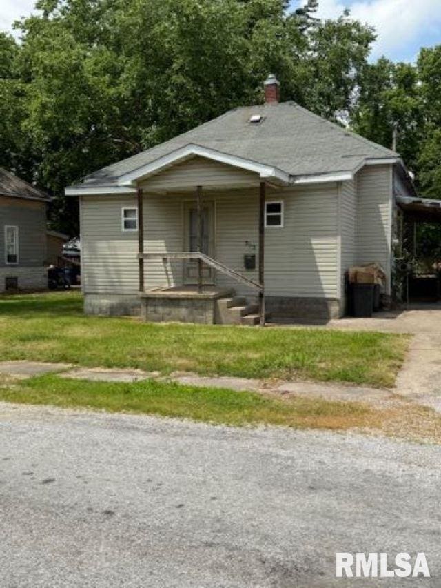 313 E 4th St, West Frankfort, IL 62896 - bungalow-style house with a chimney