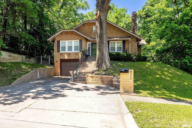 850 27th St, Rock Island, IL 61201 - view of front facade with brick siding, driveway, stairs, a garage, and a front lawn