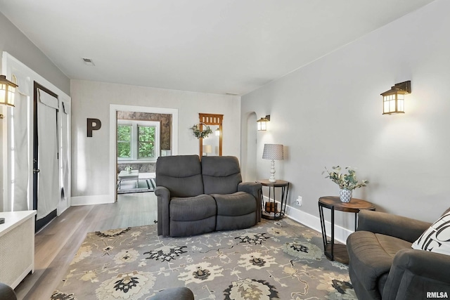 850 27th St, Rock Island, IL 61201 - living area with wood finished floors and arched walkways