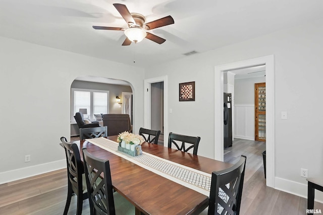 850 27th St, Rock Island, IL 61201 - dining area with arched walkways, ceiling fan, and wood finished floors