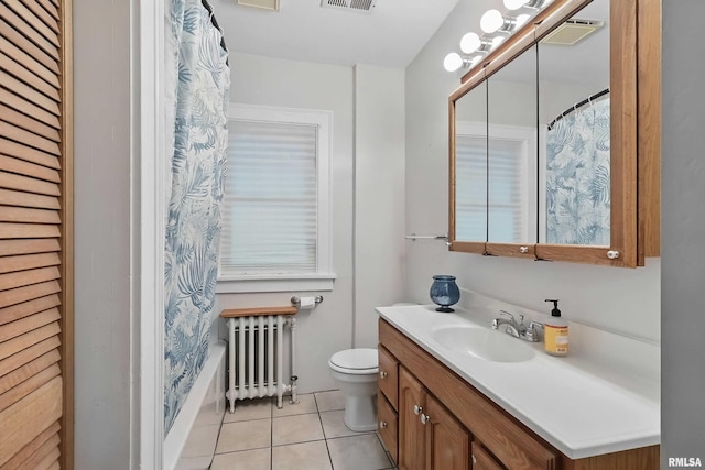 850 27th St, Rock Island, IL 61201 - bathroom with radiator, vanity, tile patterned flooring, and shower / bathtub combination with curtain