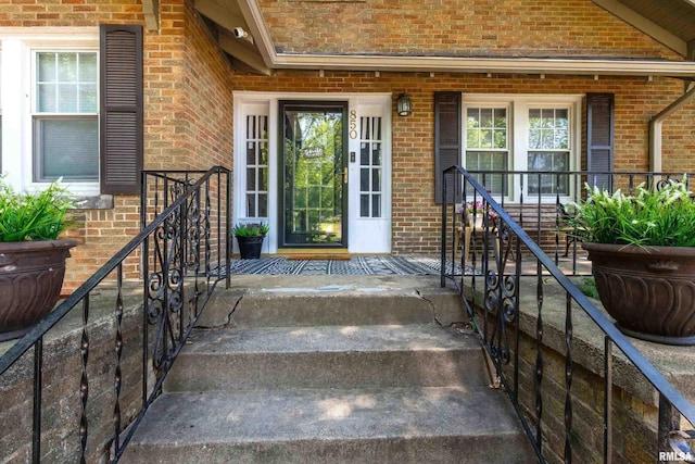850 27th St, Rock Island, IL 61201 - view of exterior entry featuring brick siding and a porch