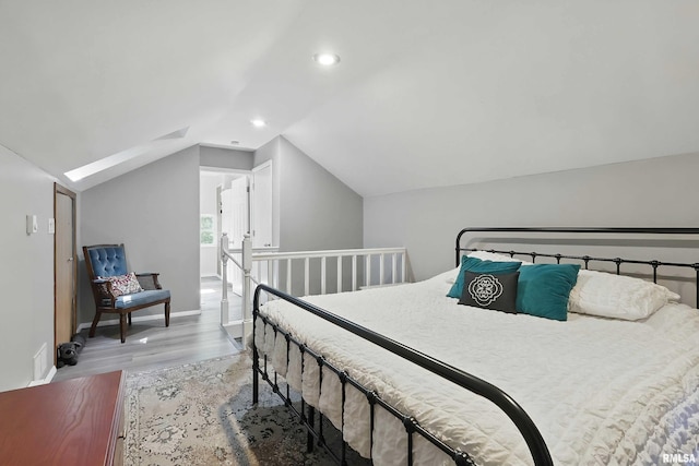 850 27th St, Rock Island, IL 61201 - bedroom with wood finished floors, lofted ceiling, a skylight, and recessed lighting